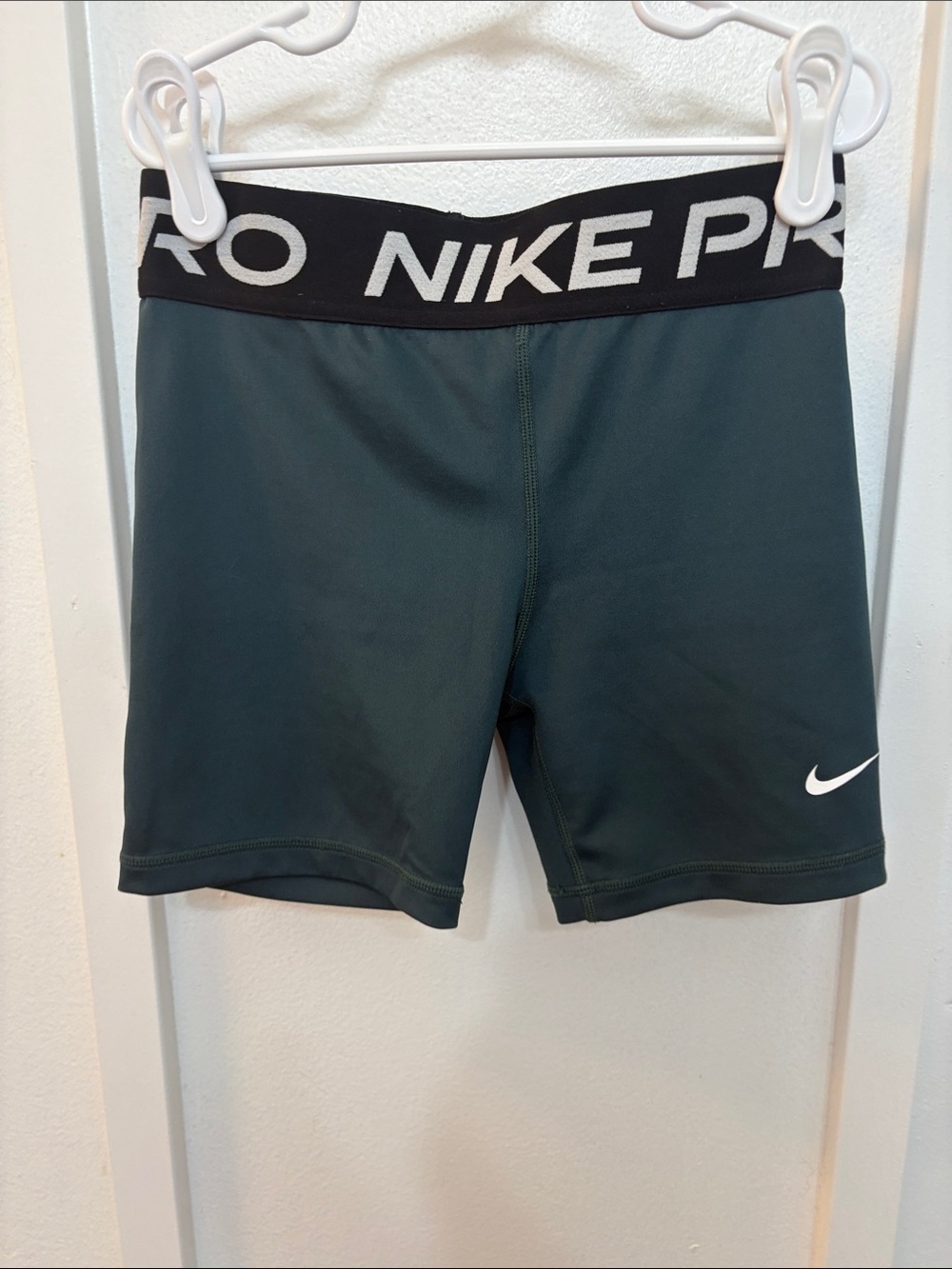 Nike Green Compression Shorts with Black Waistband and White Swoosh